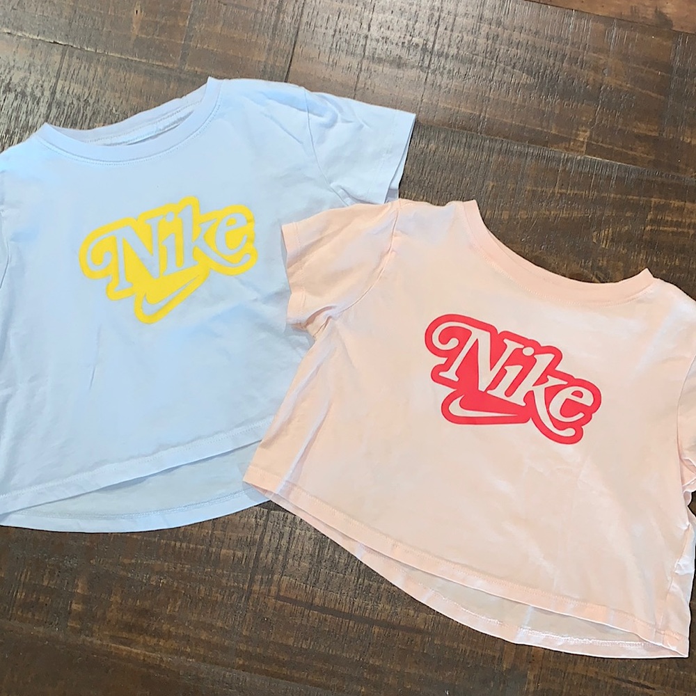 Two cropped Nike shirts